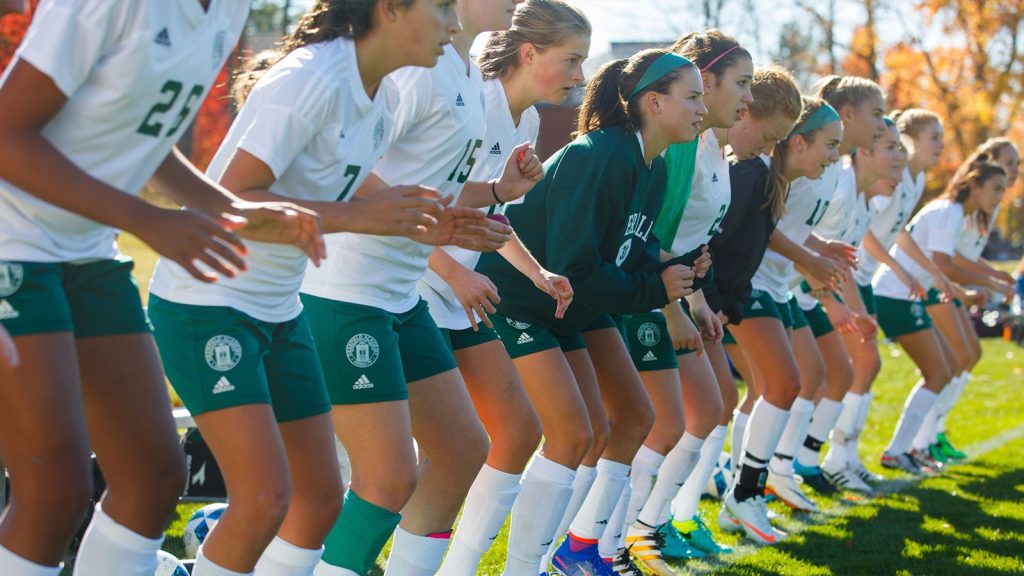 A girls’ soccer team in a line during warm-up