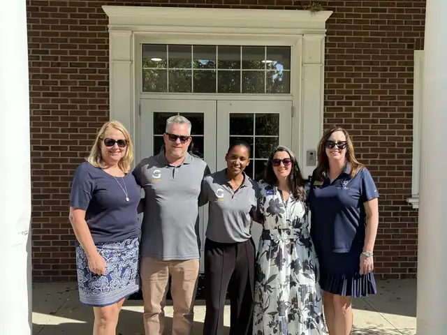 GESP team with school representatives during an on-campus visit