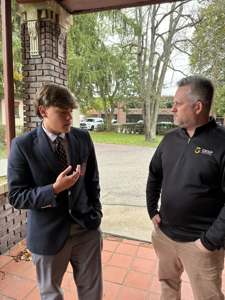 GESP advisor Matt Kokoszka talking with a boarding school student on campus